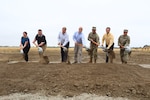 A ceremonial groundbreaking is held May 19, 2022, for an energy resilience project at Joint Forces Training Base in Los Alamitos, California. From left: Stephanie Kline, project director, and Robert Hughes, executive director, both with the U.S. Army Office of Energy Initiatives; Robert Smith, president of Bright Canyon Energy; Paul Farnan, principal deputy, assistant Secretary of the Army for installations, energy and environment; U.S. Army Command Sgt. Maj. Refugio Rosas, from the 40th Infantry Division, California Army National Guard; Anthony Marasa, project manager with Bright Canyon Energy; and Lt. Col. Manju Vig, garrison commander of Joint Forces Training Base, Los Alamitos.