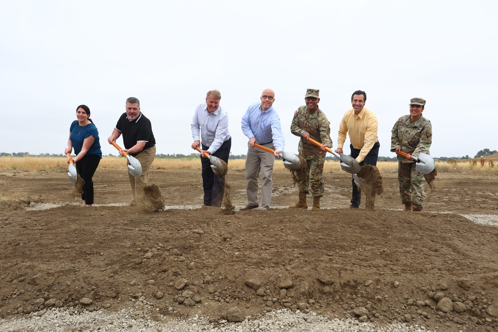 A ceremonial groundbreaking is held May 19, 2022, for an energy resilience project at Joint Forces Training Base in Los Alamitos, California. From left: Stephanie Kline, project director, and Robert Hughes, executive director, both with the U.S. Army Office of Energy Initiatives; Robert Smith, president of Bright Canyon Energy; Paul Farnan, principal deputy, assistant Secretary of the Army for installations, energy and environment; U.S. Army Command Sgt. Maj. Refugio Rosas, from the 40th Infantry Division, California Army National Guard; Anthony Marasa, project manager with Bright Canyon Energy; and Lt. Col. Manju Vig, garrison commander of Joint Forces Training Base, Los Alamitos.