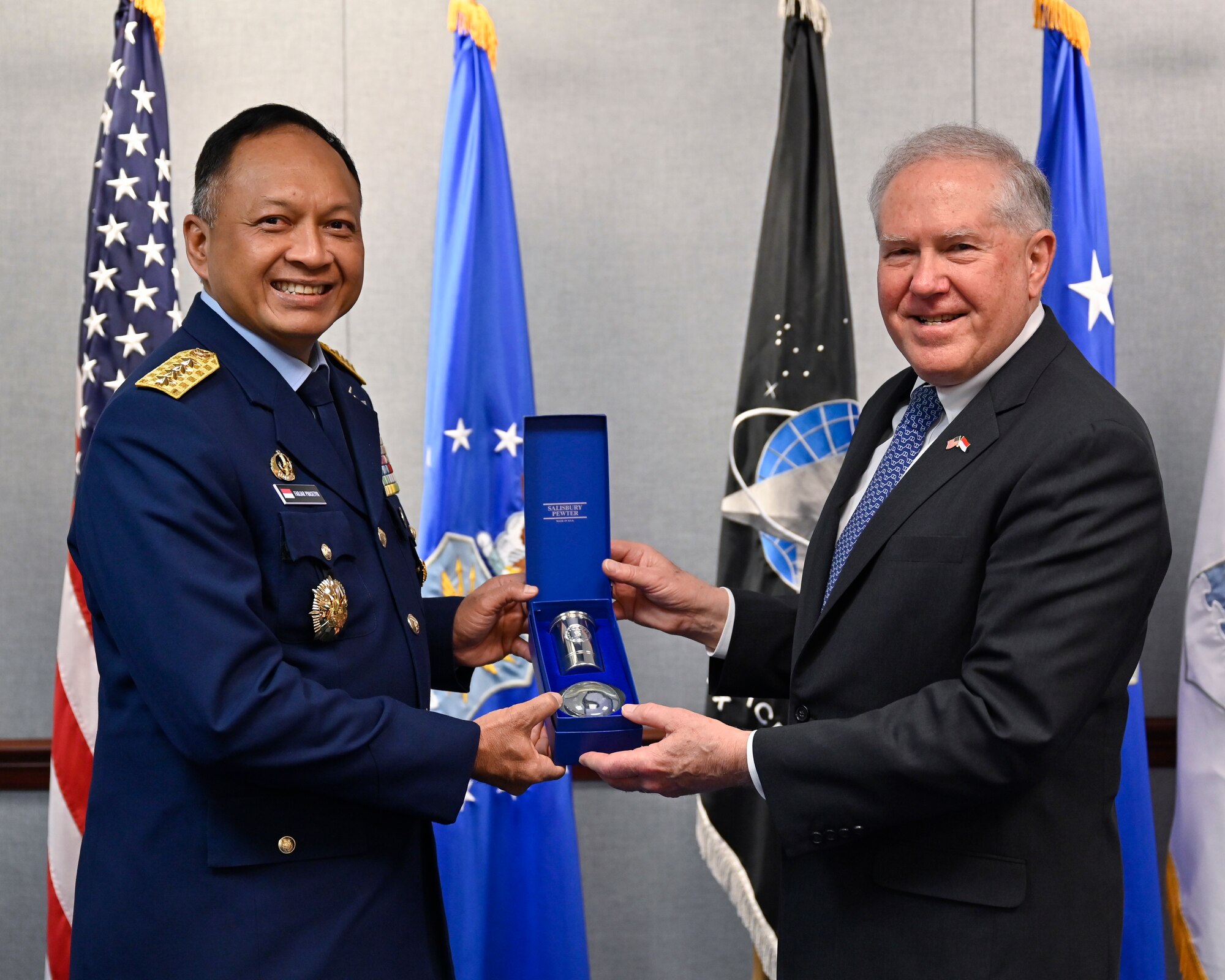 Secretary of the Air Force Frank Kendall, right, poses with Air Chief Marshal Fadjar Prasetyo.