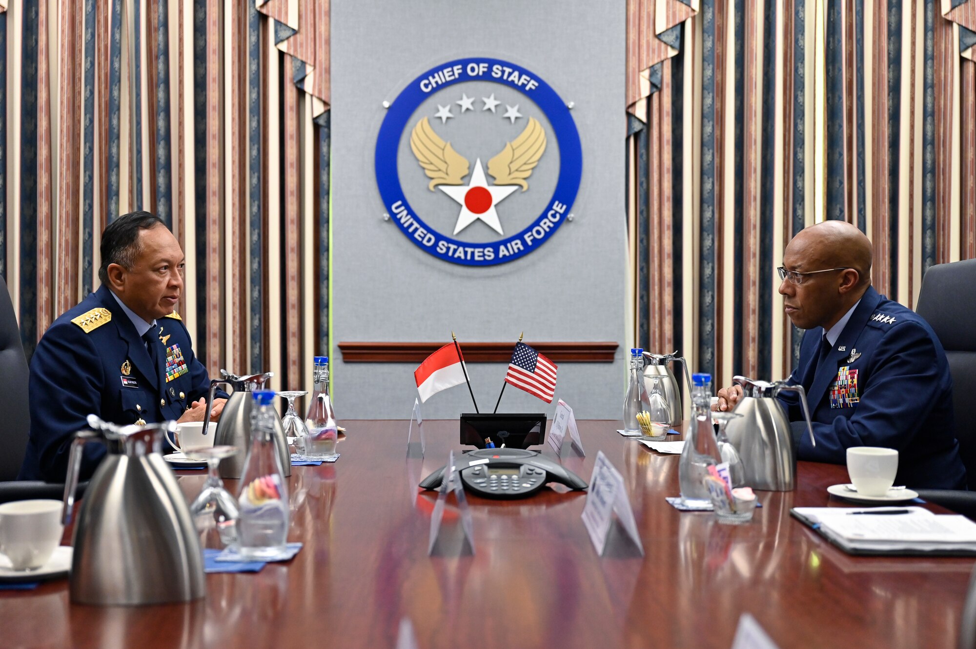 Air Chief Marshal Fadjar Prasetyo, left, chief of staff of the Indonesian Air Force, speaks with Air Force Chief of Staff Gen. CQ Brown, Jr.