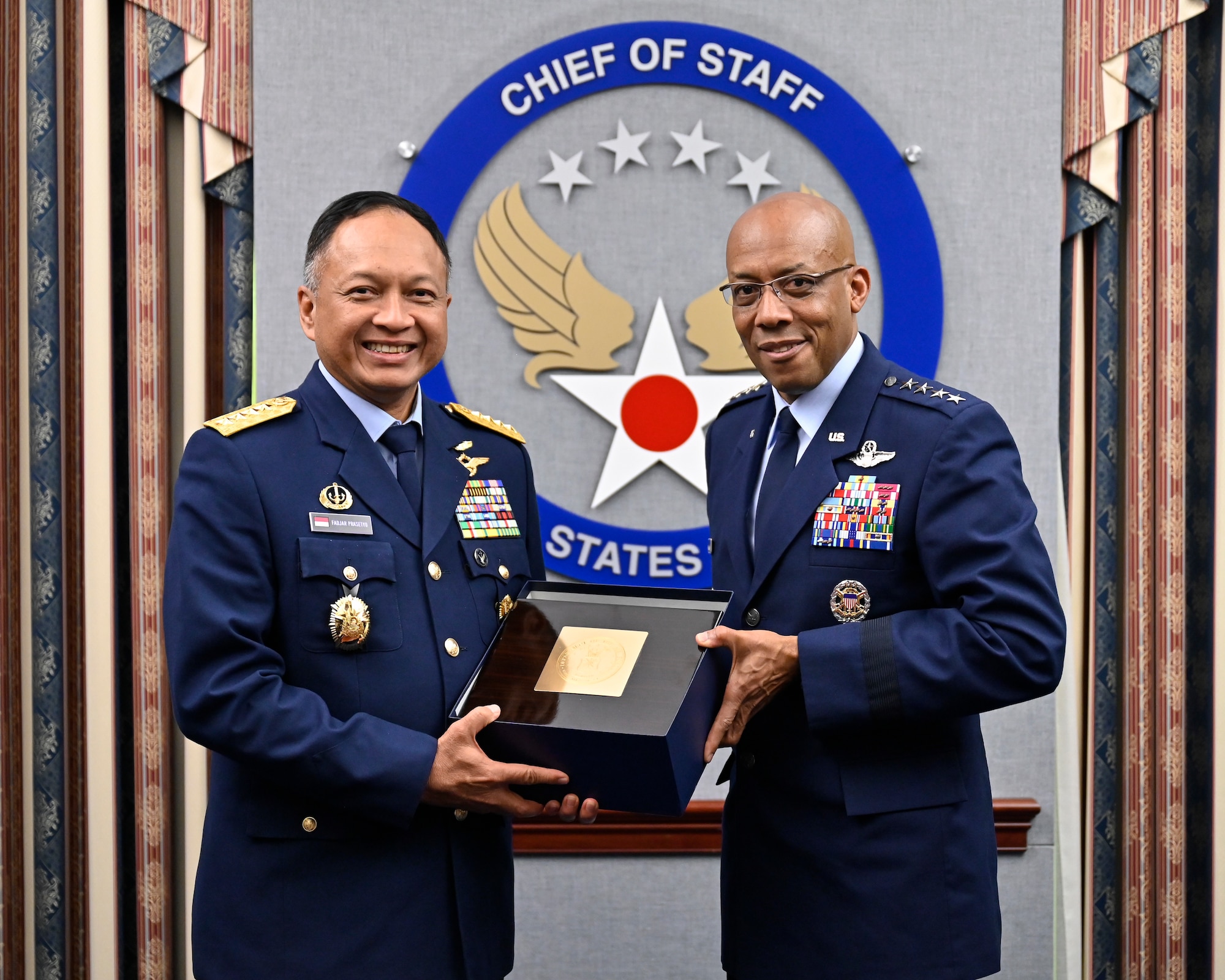 Air Force Chief of Staff Gen. CQ Brown, Jr., right, poses with Air Chief Marshal Fadjar Prasetyo, chief of staff of the Indonesian Air Force.