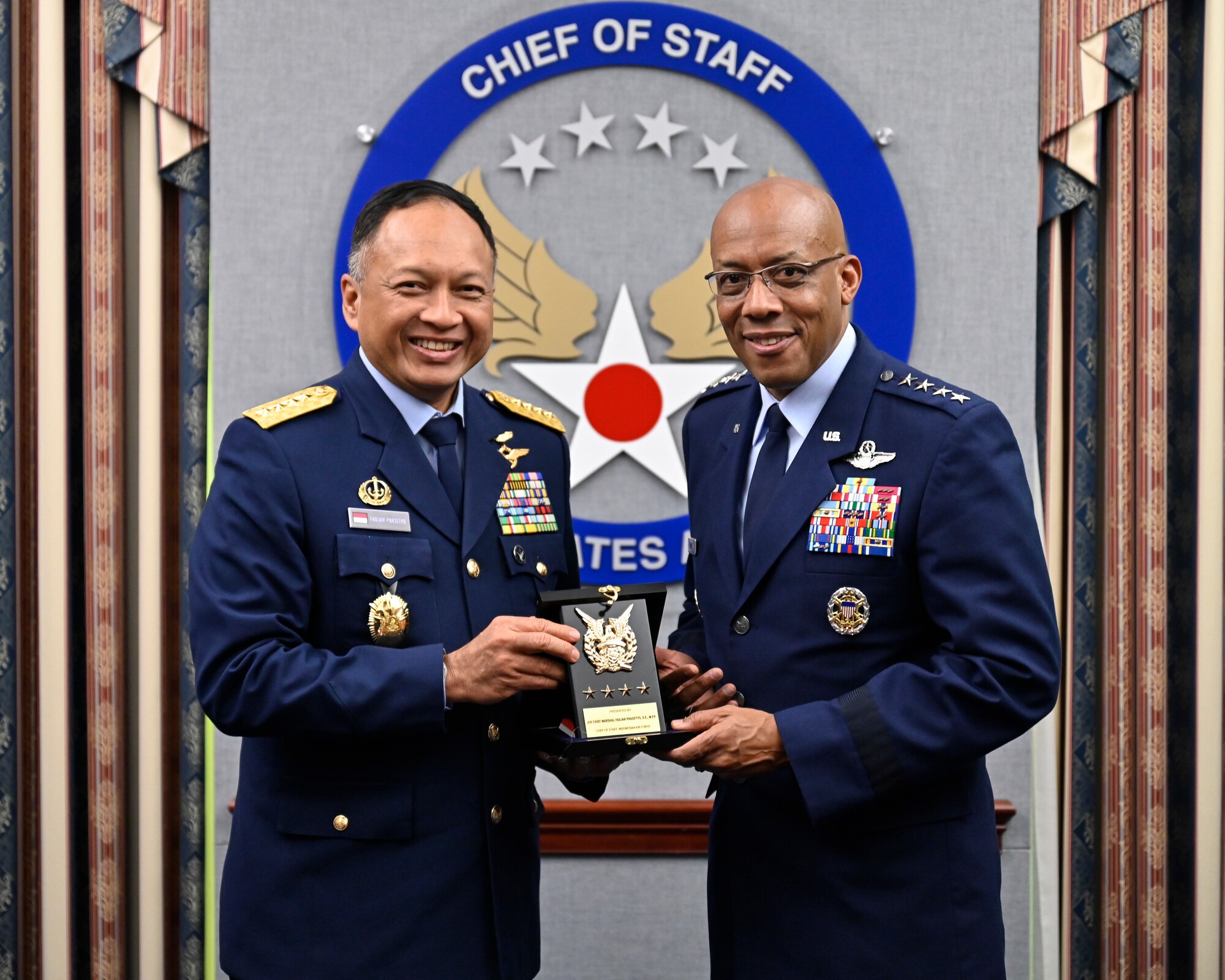 Air Force Chief of Staff Gen. CQ Brown, Jr., right, poses with Air Chief Marshal Fadjar Prasetyo.