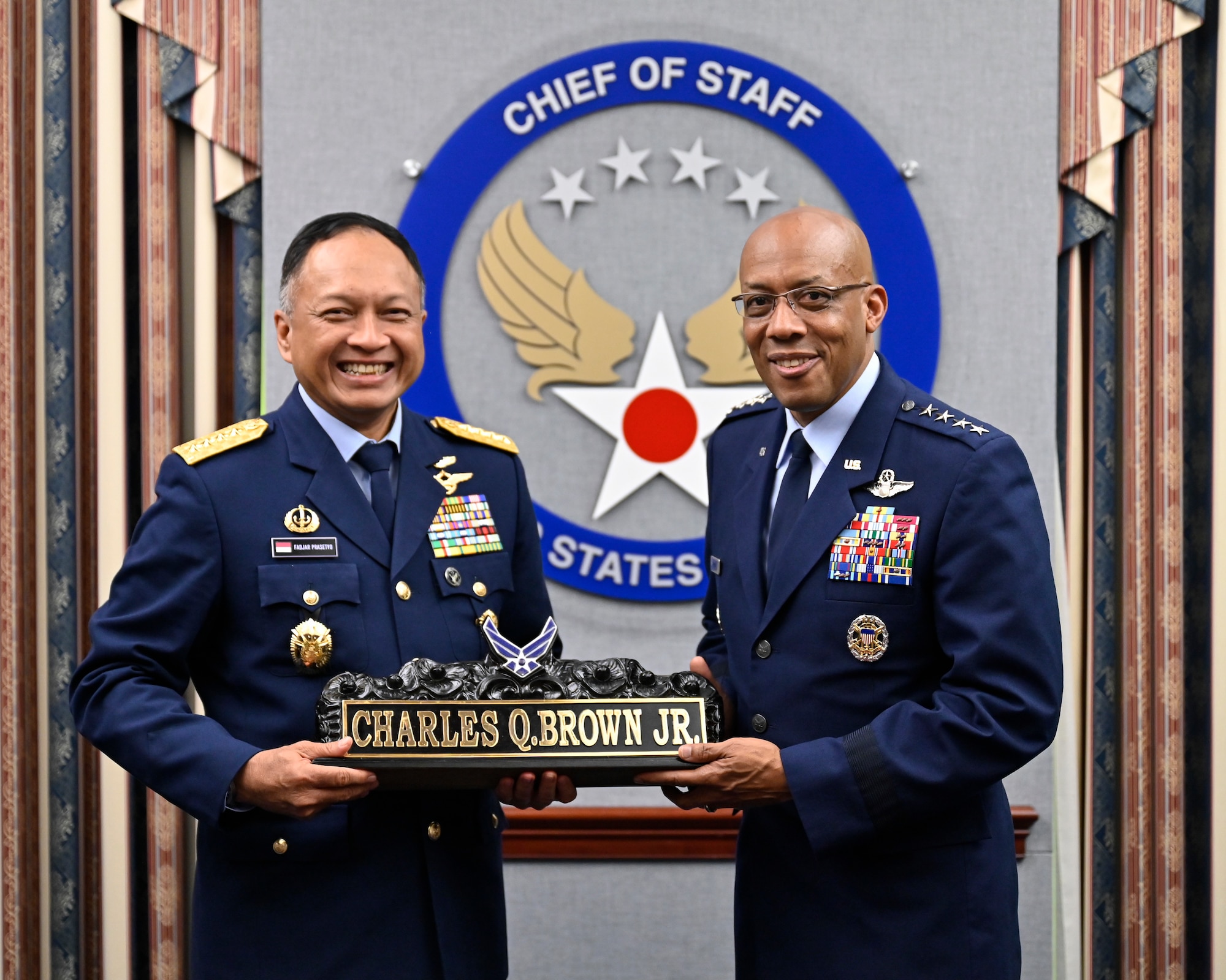 Air Force Chief of Staff Gen. CQ Brown, Jr., right, poses with Air Chief Marshal Fadjar Prasetyo.