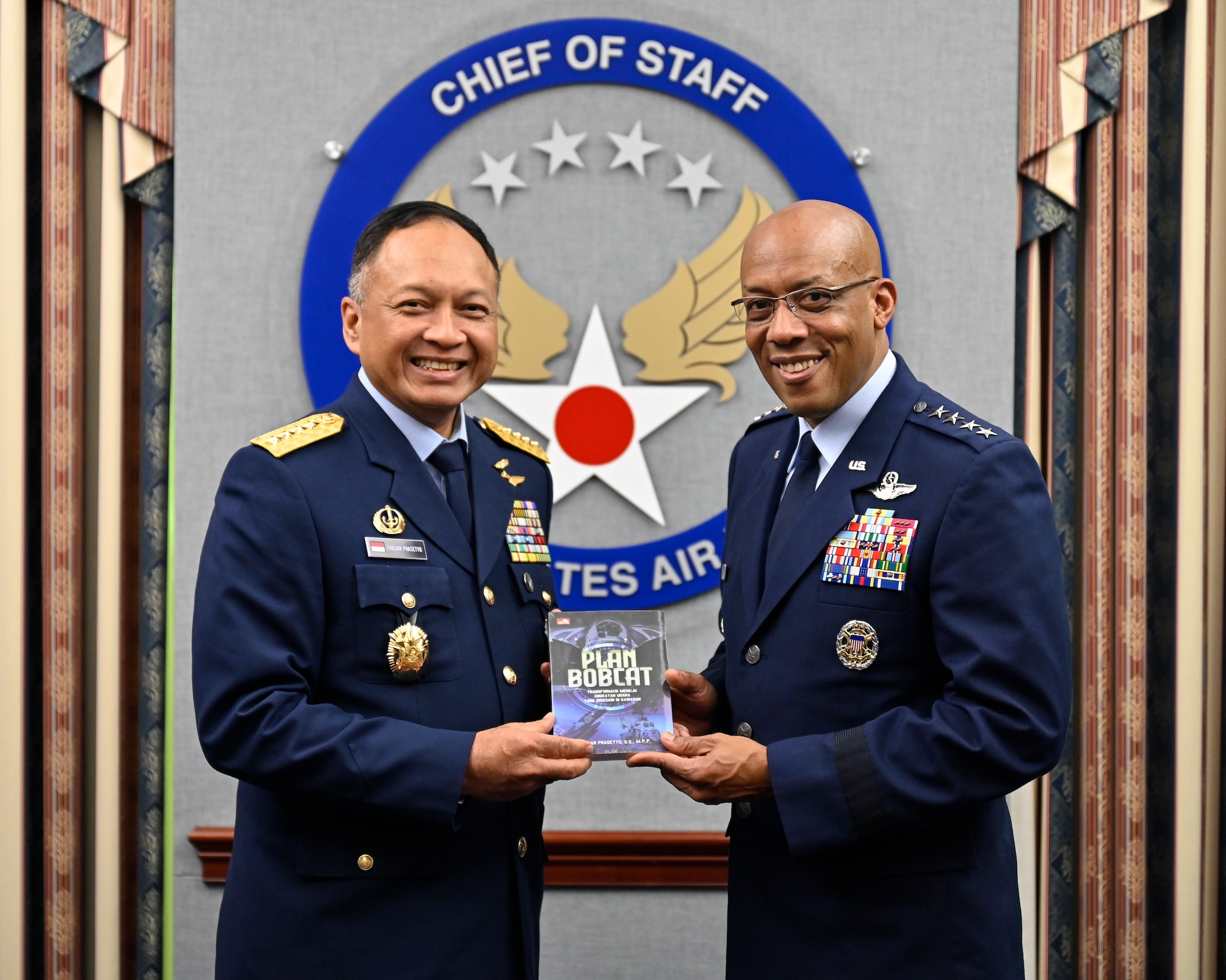 Air Force Chief of Staff Gen. CQ Brown, Jr., right, poses with Air Chief Marshal Fadjar Prasetyo.