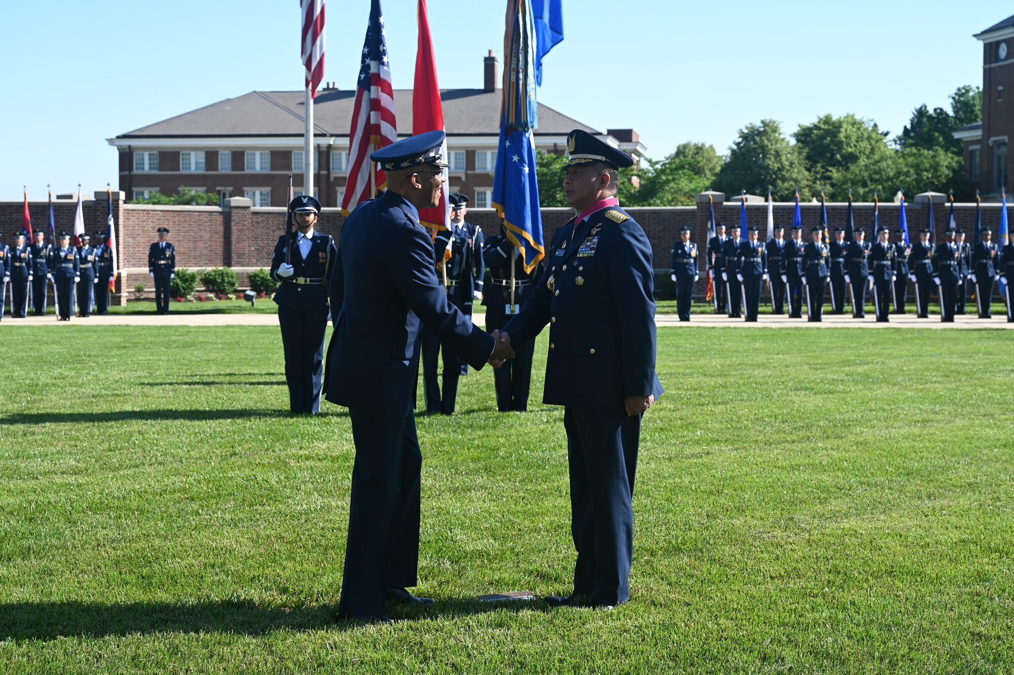 Air Force Chief of Staff Gen. CQ Brown, Jr. presents the Legion of Merit medal to Air Chief Marshal Fadjar Prasetyo.