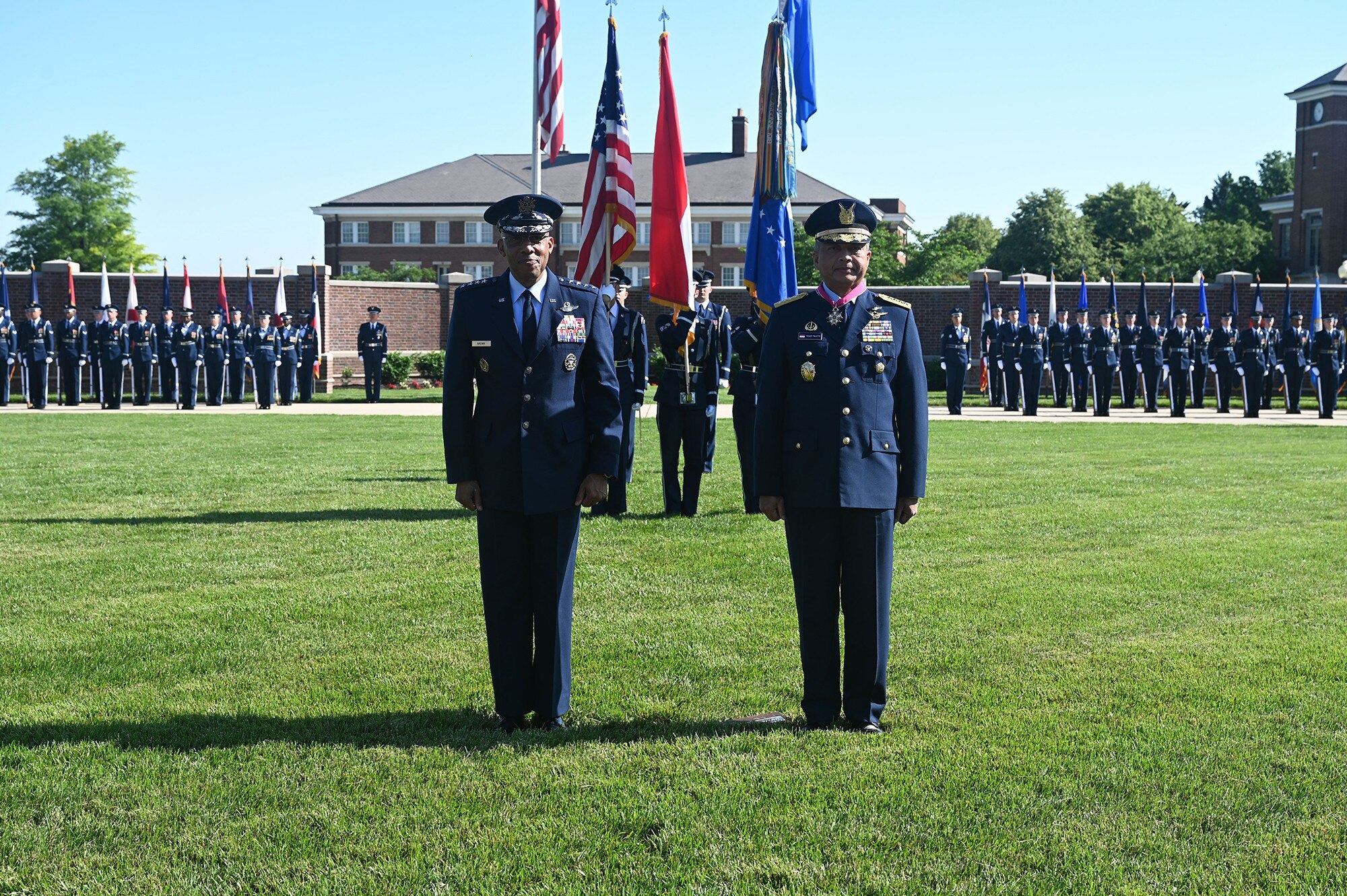 Air Force Chief of Staff Gen. CQ Brown, Jr. presents the Legion of Merit medal to Air Chief Marshal Fadjar Prasetyo.