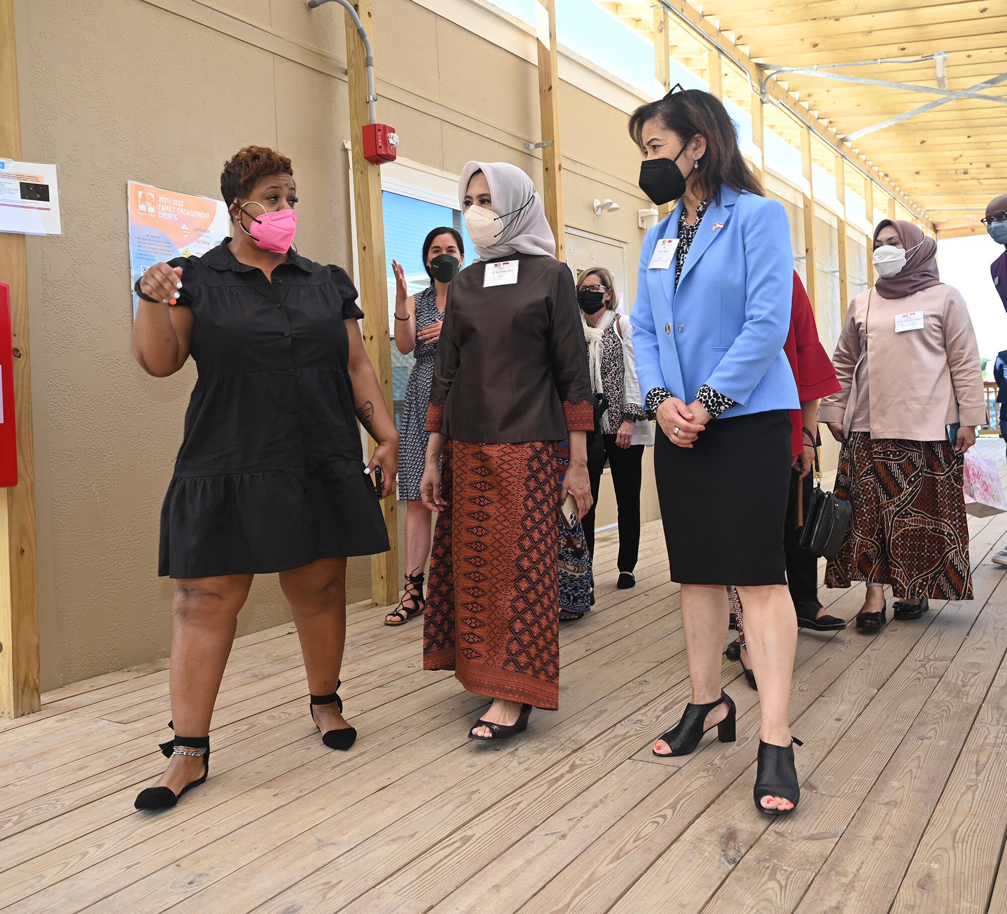 Wife of Air Force Chief of Staff Gen. Charles CQ Brown, Jr.,  Sharene Brown (right) tours a small school with visiting spouse of Indonesian  Air Chief Marshal Fadjar Prasetyo, Andarini Inong Putri (center).