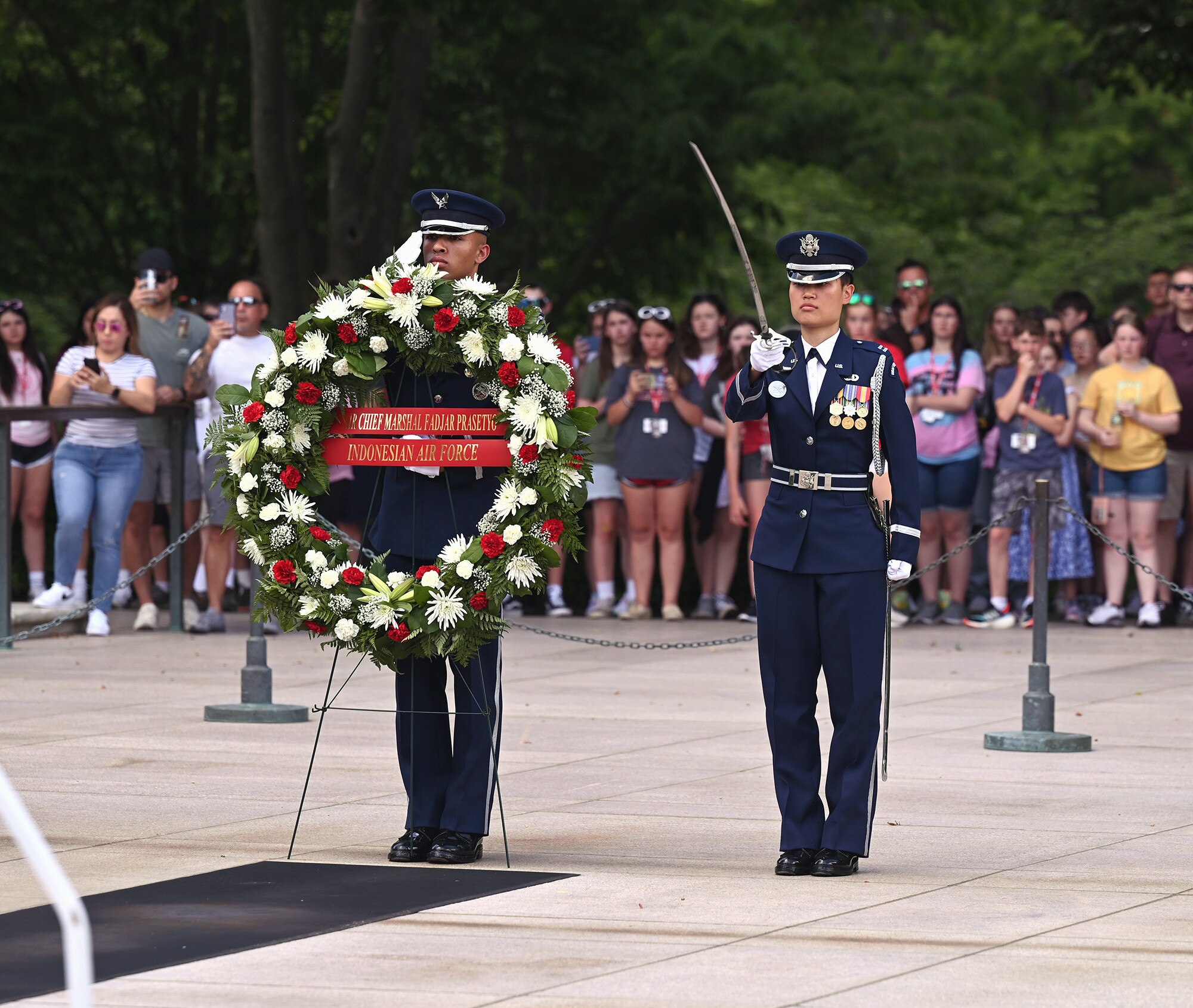 Members of the Air Force Honor Guard stand by to assist Air Force Maj. Gen. Joel Jackson and Indonesian Air Chief Marshal Fadjar Prasetyo with a wreath laying ceremony at the Tomb of the Unknown Soldier