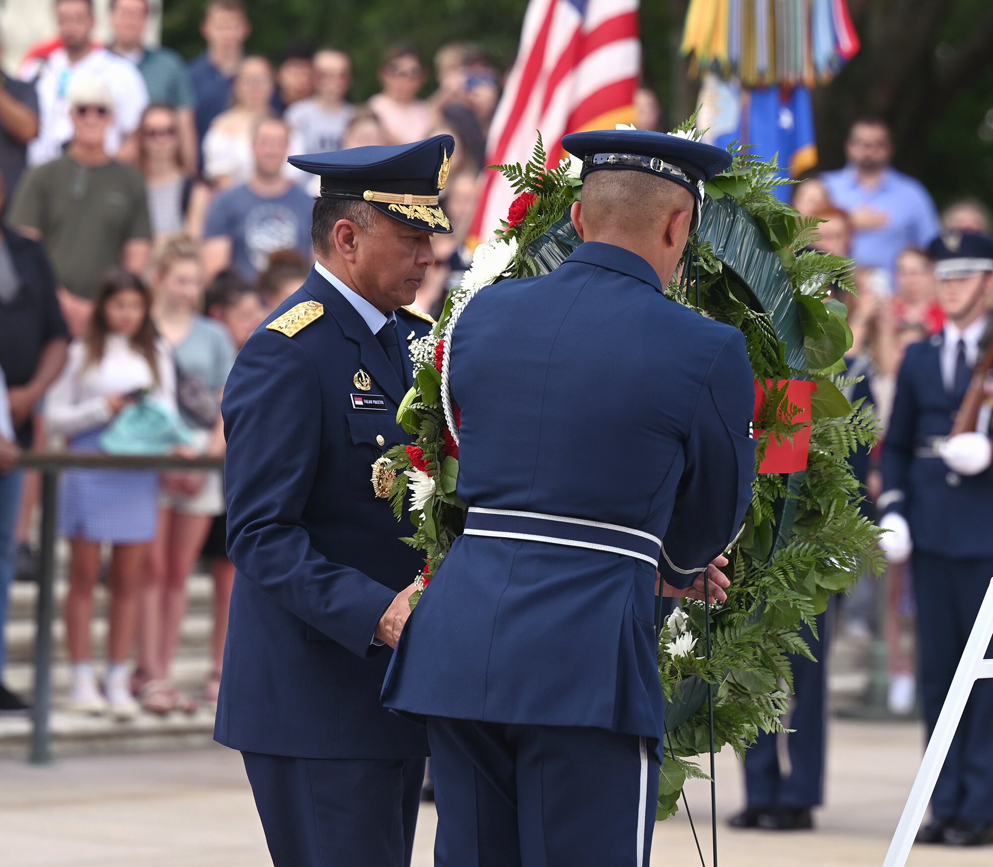 With assistance from a member of the Air Force Honor Guard, Air Chief Marshal Fadjar Prasetyo lays a wreath at the Tomb of the Unknown Soldier