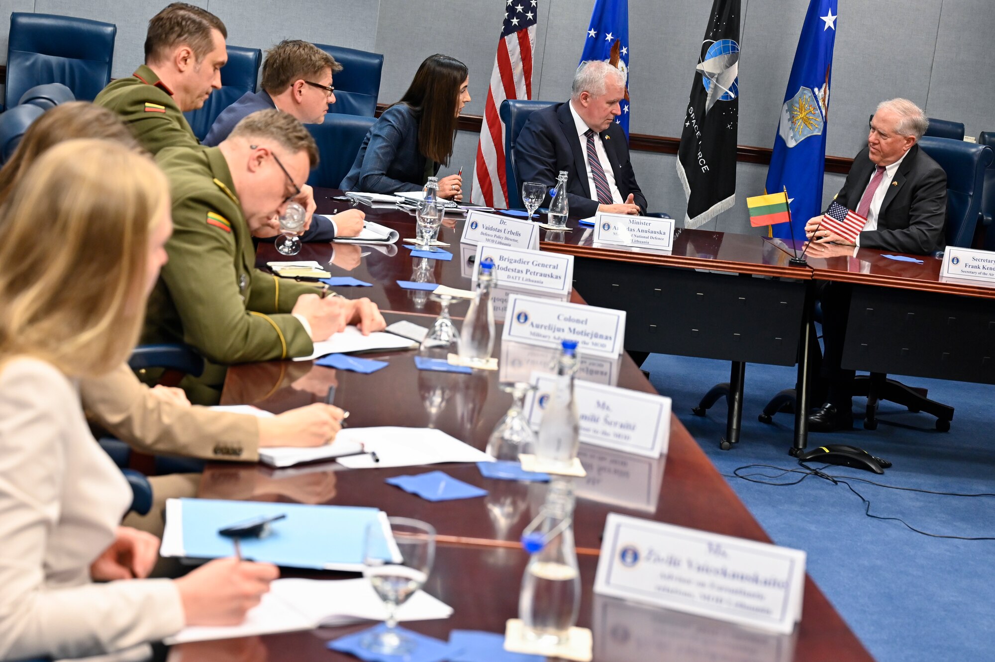 Secretary of the Air Force Frank Kendall, top right, speaks with Lithuanian Minister of National Defense Arvydas Anušauskas during a meeting.