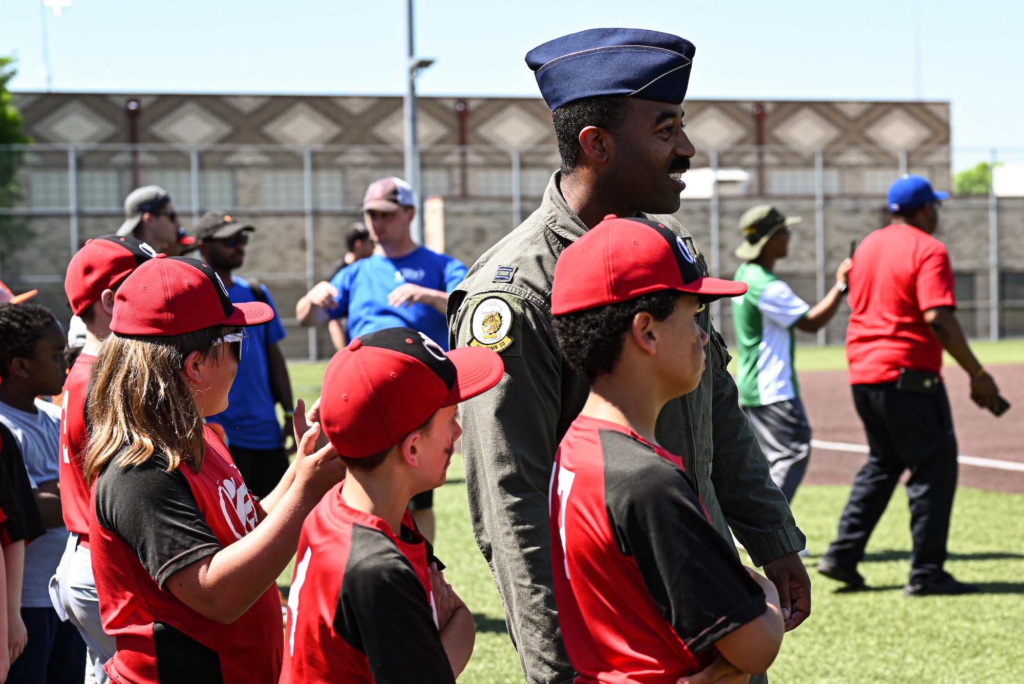 A U.S. Air Force B-2 Spirit pilot engages with youth baseball teams during the Diversity in the Dugout event at the Kansas City Royals Urban Youth Academy, Missouri, May 14, 2022. The pilot assigned to Whiteman was invited to talk about hardships he faced as a young black man and overcoming negative views of diversity of those around him. This Juneteenth linked event is designed to educate kids on the importance of understanding diversity in a fun environment. (U.S. Air Force photo by Airman 1st Class Victoria Hommel)