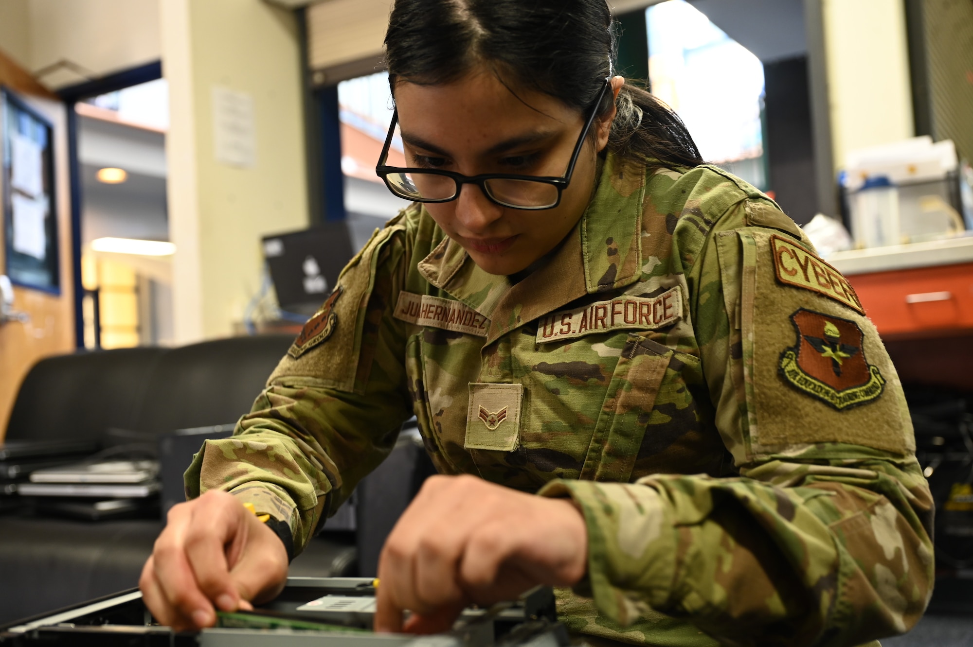 U.S. Air Force Airman 1st Class Arely Juarez Hernandez, client systems operator assigned to the 517th Training Group, replaces a graphics card in a desktop computer at Presidio of Monterey, Calif., May 12, 2022. Juarez Hernandez is trained to work on both hardware and software to support the 517th TRG mission. (U.S. Air Force photo by Master Sgt. Jocelyn A. Ford)
