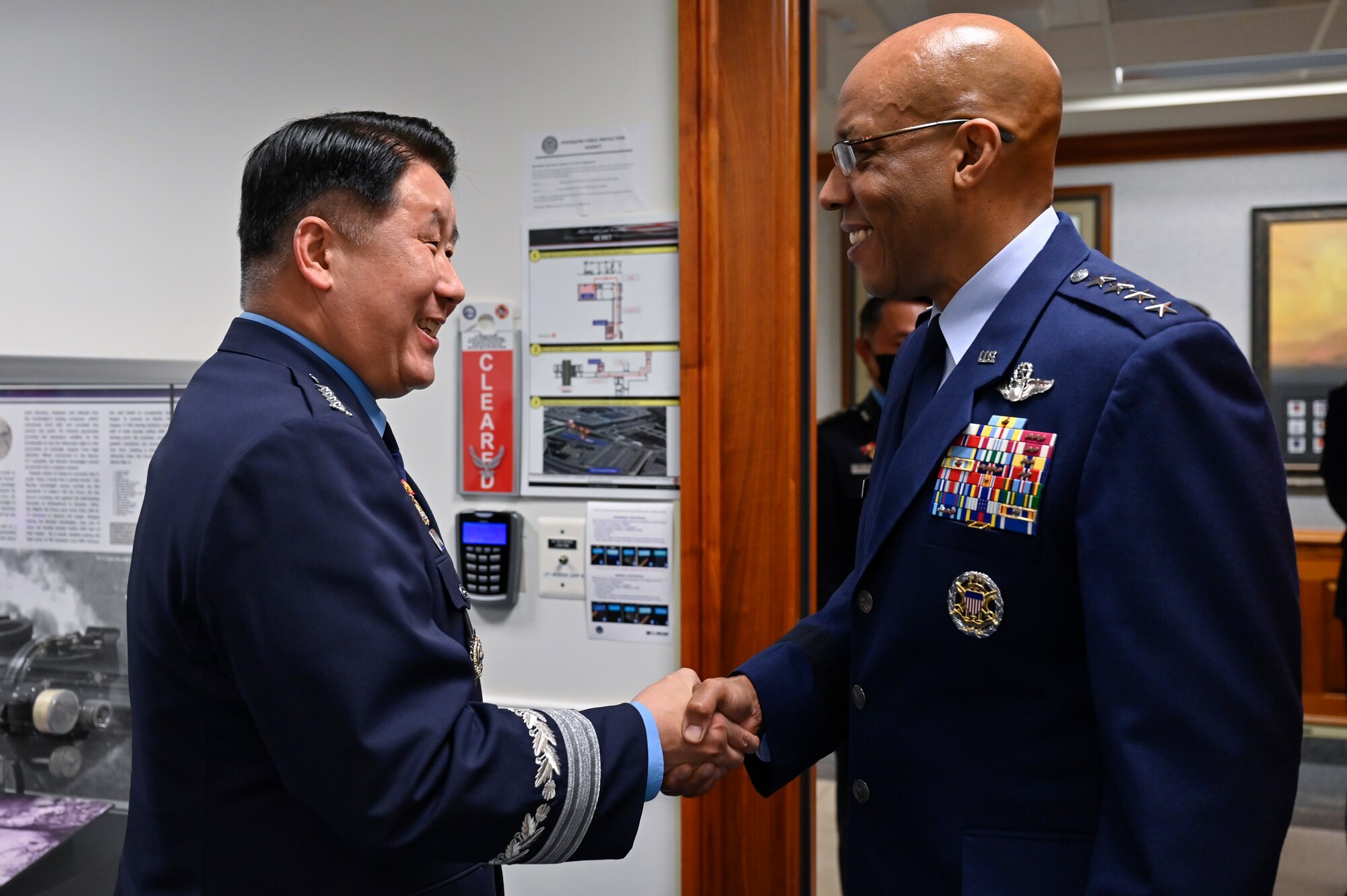 Air Force Chief of Staff Gen. CQ Brown, Jr., right, greets Chief of Staff of the Republic of Korea Air Force Gen. Park Inho.