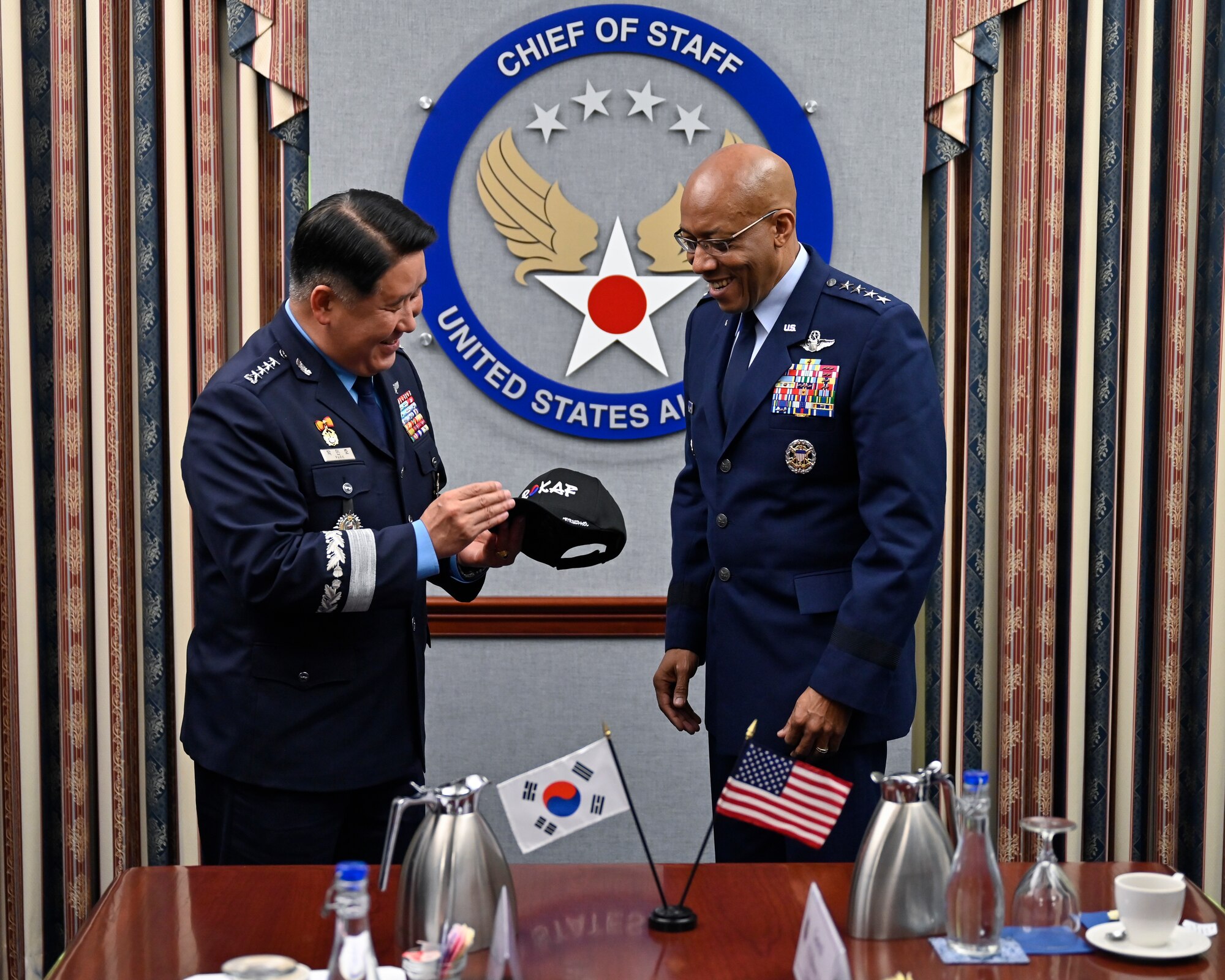 Chief of Staff of the Republic of Korea Air Force Gen. Park Inho, left, presents a gift to Air Force Chief of Staff Gen. CQ Brown, Jr.