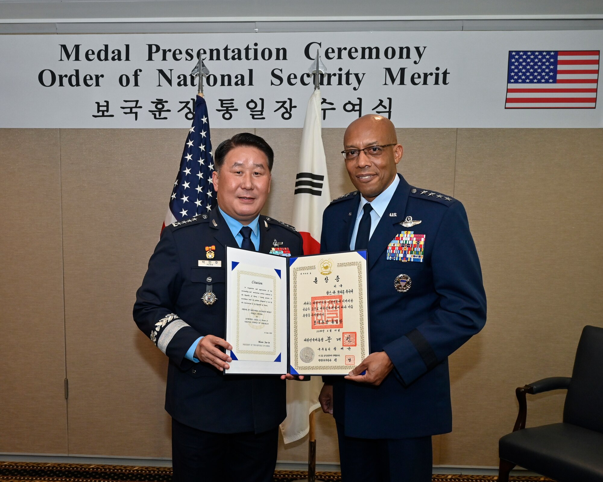 Air Force Chief of Staff Gen. CQ Brown, Jr., right, poses with Chief of Staff of the Republic of Korea Air Force Gen. Park Inho.