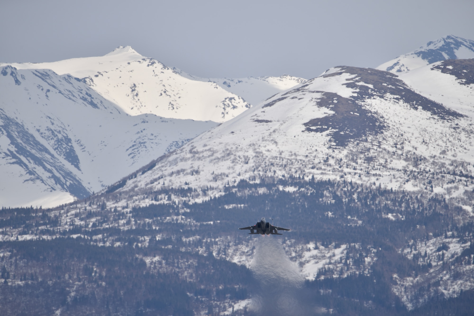 An F-15C Eagle fighter jet assigned to the California Air National Guard’s 144th Fighter Wing takes off Joint Base Elmendorf-Richardson, Alaska, April 20, 2022, while conducting dissimilar air combat training with the 3rd Wing’s F-22 Raptors.