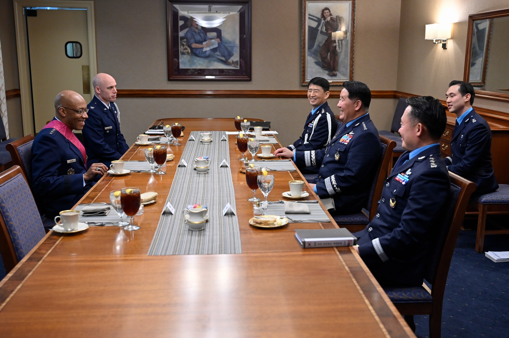 Chief of Staff of the Republic of Korea Air Force Gen. Park Inho, center right, speaks with Air Force Chief of Staff Gen. CQ Brown, Jr. after an award ceremony.