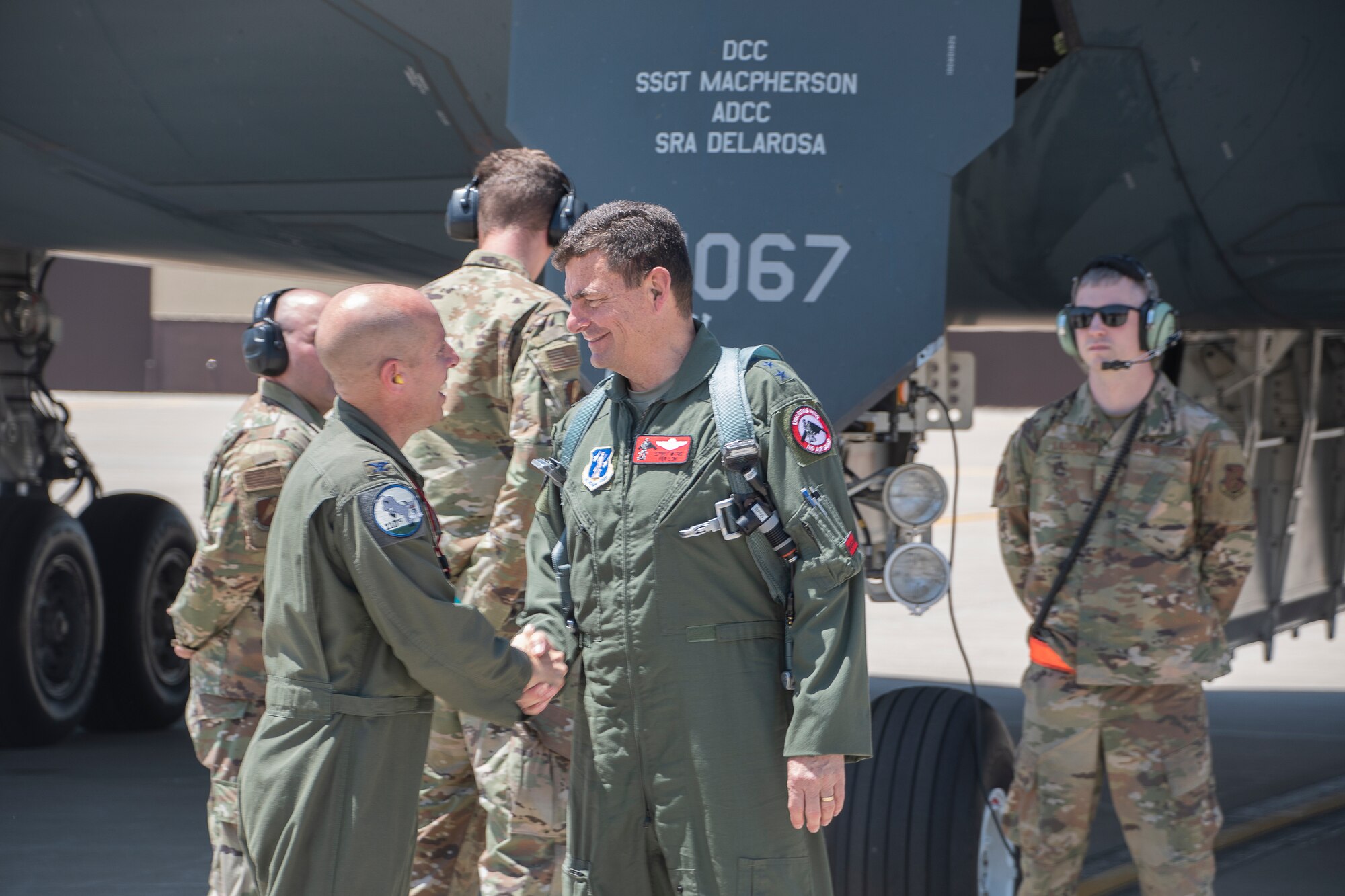 U.S. Air Force Lt. Gen. Michael A. Loh, Director, Air National Guard, shakes hands with Col. Matthew D. Calhoun, commander, 131st Bomb Wing, Missouri Air National Guard, after a successful flight in a B-2 Spirit stealth bomber at Whiteman Air Force Base, Missouri, May 14, 2022. Loh visited Whiteman AFB to observe its operations involving total force integration and combat readiness. (U.S. Air National Guard photo by Airman 1st Class Kelly C. Ferguson)