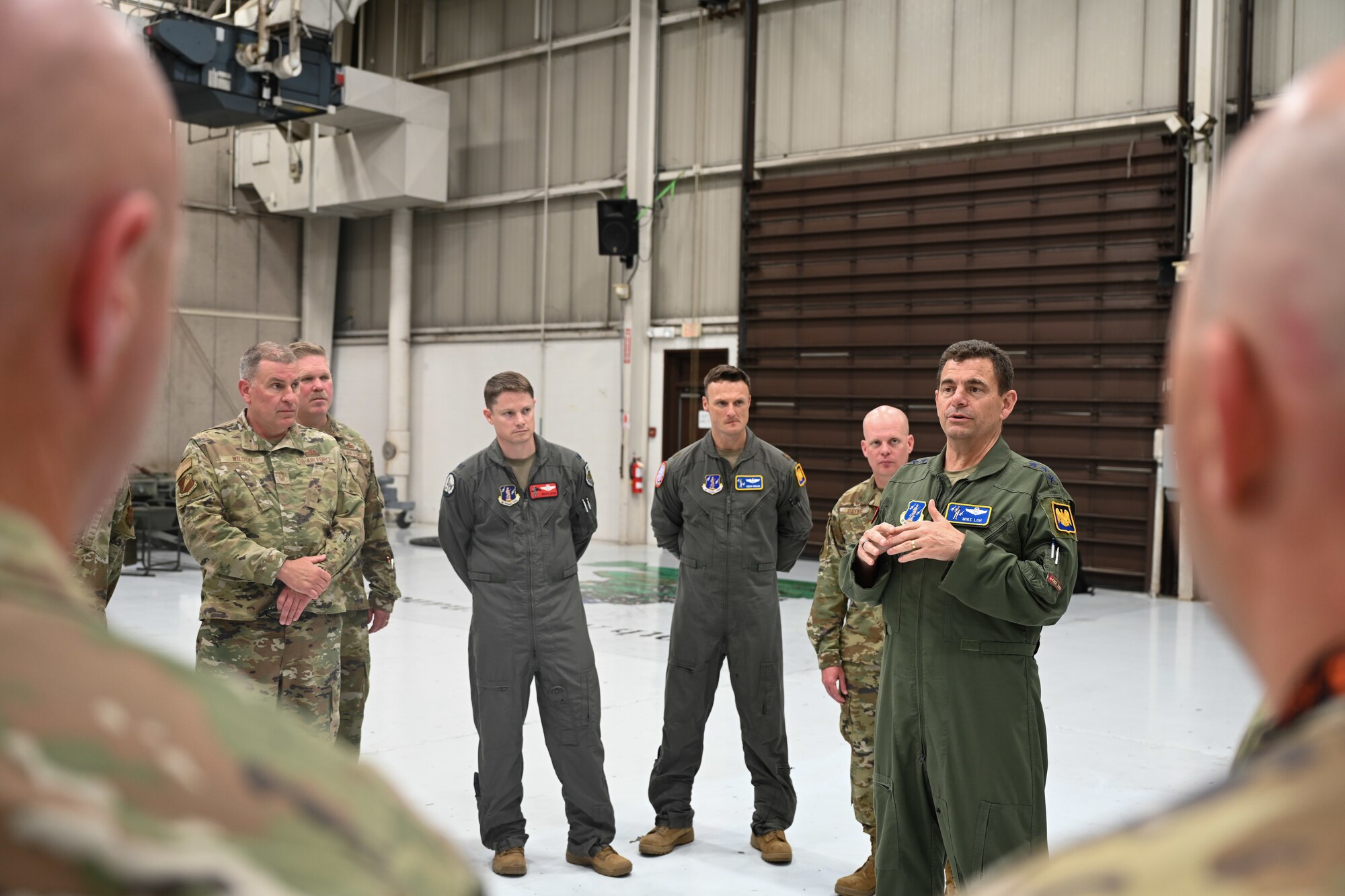 U.S. Air Force Lt. Gen. Michael Loh, director, Air National Guard, visits the Weapons Load Trainer at Whiteman Air Force Base, Missouri, May 13, 2022. The trainer allows Team Whiteman Airmen to learn all aspects of the munitions enterprise for the B-2 Spirit bomber in a safe and controlled environment. (U.S. Air Force photo by Airman 1st Class Bryson Britt