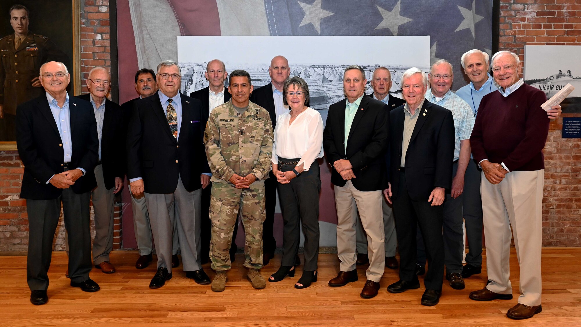 New Hampshire Adjutant Gen. David Mikolaities poses with distinguished guests during the NHNG's Heritage Room ribbon-cutting ceremony held in Concord on May 20, 2022.