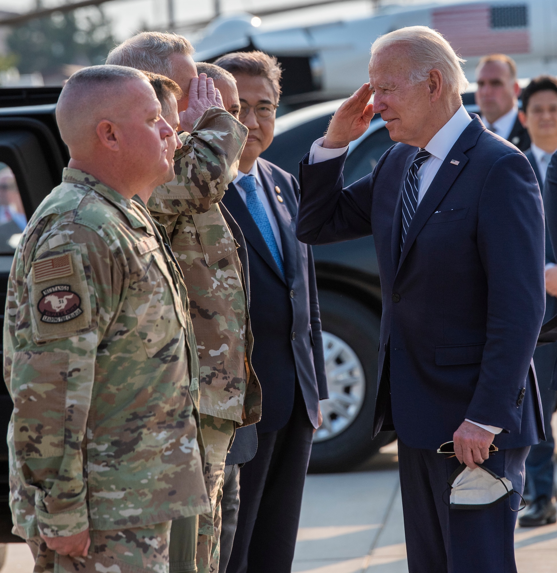 United States President Joe Biden interacts with Col. Joshua Wood, 51st Fighter Wing commander, alongside leaders from the Republic of Korea at Osan Air Base, Republic of Korea, May 20, 2022.