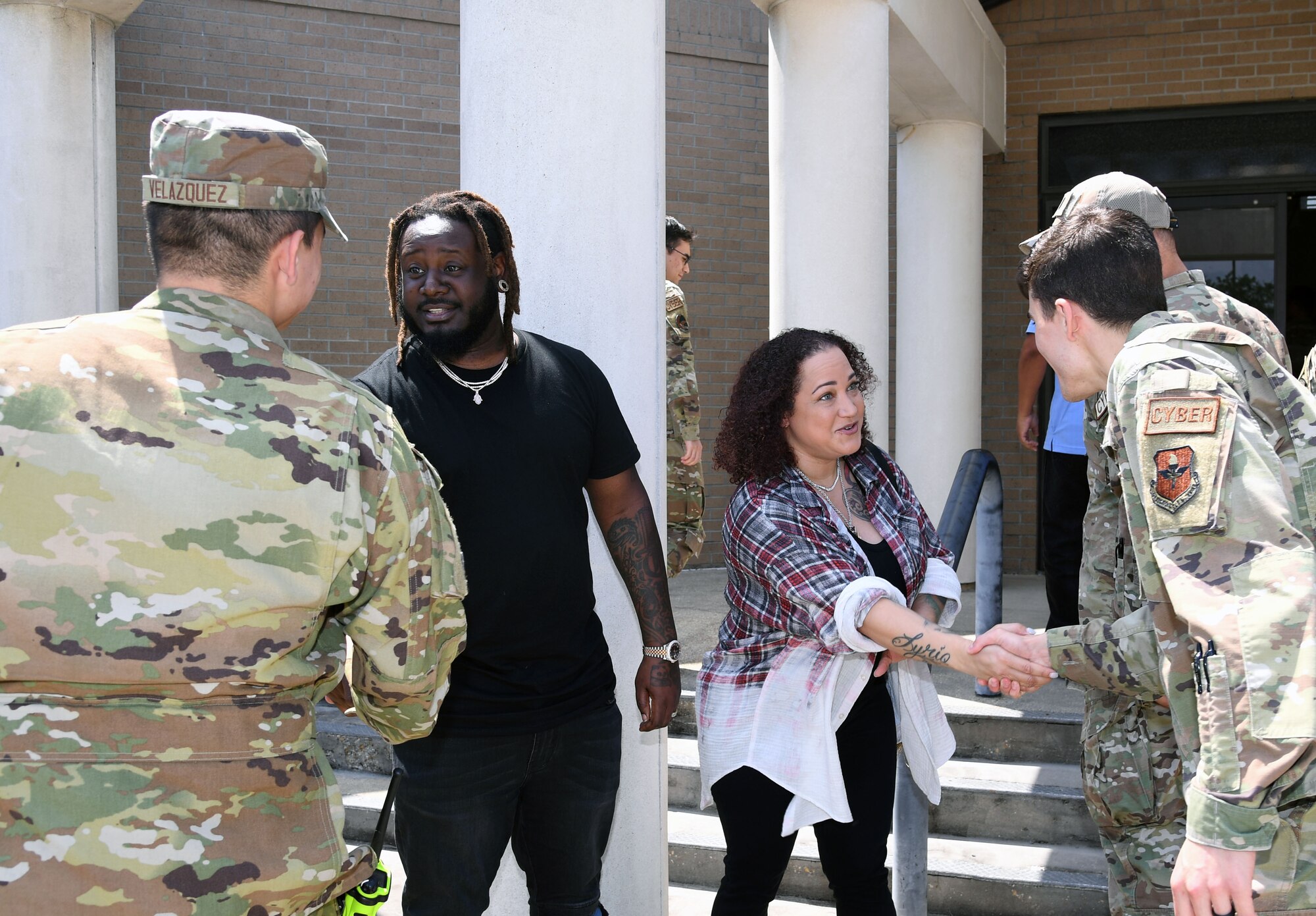 Amber Najm and her husband, T-Pain, an American rapper, meet Airmen following a tour of the 81st Communications Squadron at Keesler Air Force Base, Mississippi, May 19, 2022. Amber served in the Air Force and was assigned to the 81st CS from 2001-2004. (U.S. Air Force photo by Kemberly Groue)