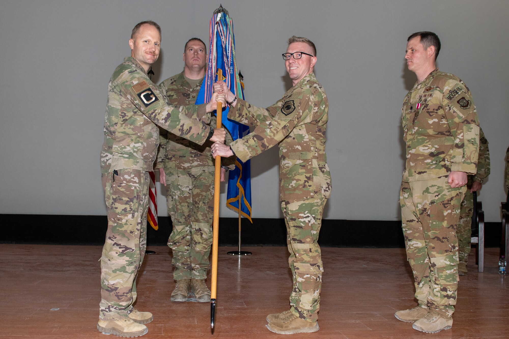 U.S. Air Force Lt. Col. Daniel Naske assumes command of the 816th Expeditionary Airlift Squadron during a change of command ceremony on Al Udeid Air Base, Qatar, May 2, 2022. Naske has over 2,700 flying hours.