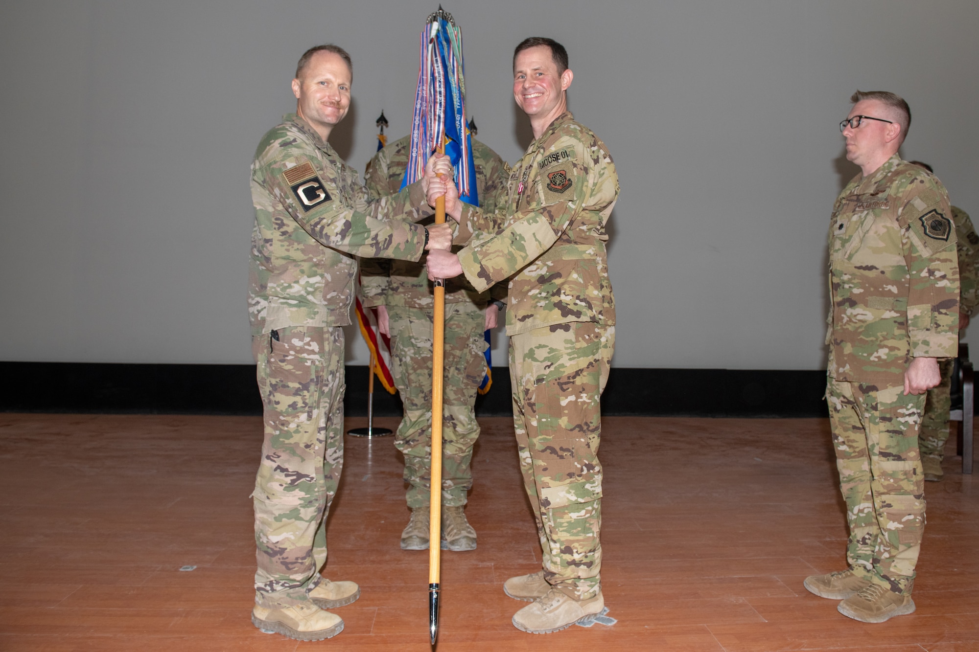 U.S. Air Force Lt. Col. Patrick McLaughlin relinquishes command of the 816th Expeditionary Airlift Squadron during a change of command ceremony on Al Udeid Air Base, Qatar, May 2, 2022. McLaughlin was also awarded the Meritorious Service Medal.