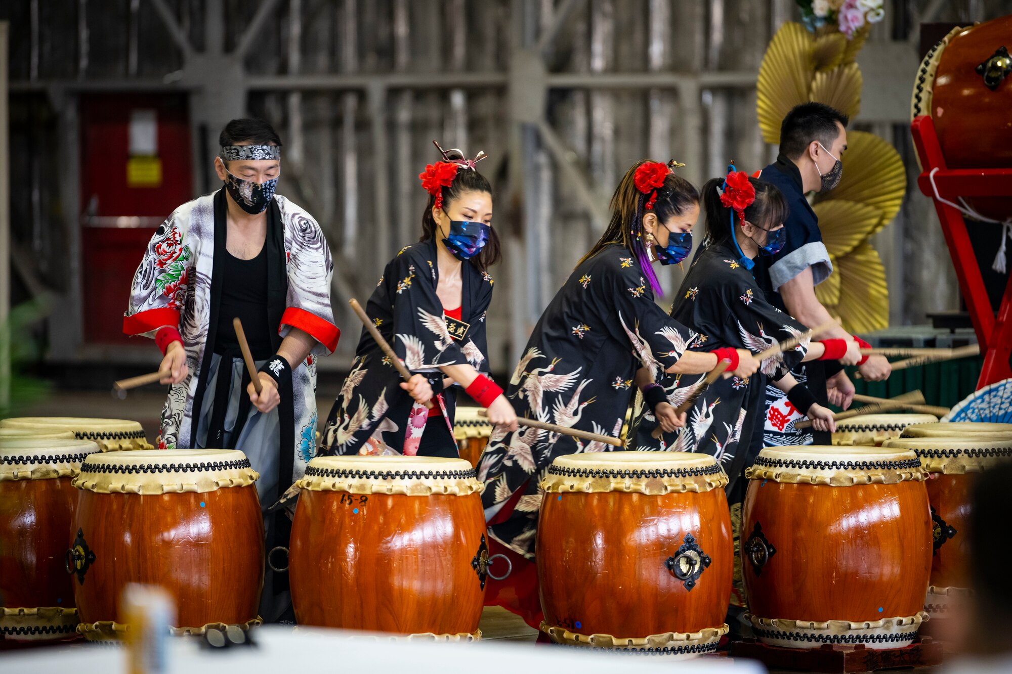 A group of team Misawa members play on drums