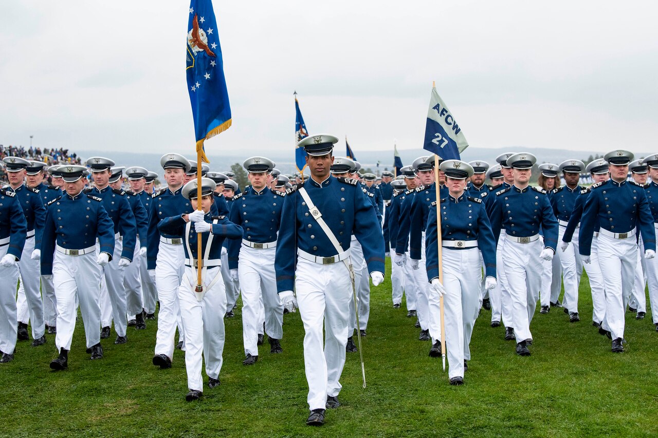 Cadets march onto a field.