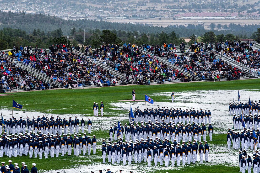 Air Force and Space Force cadets stand in formation.