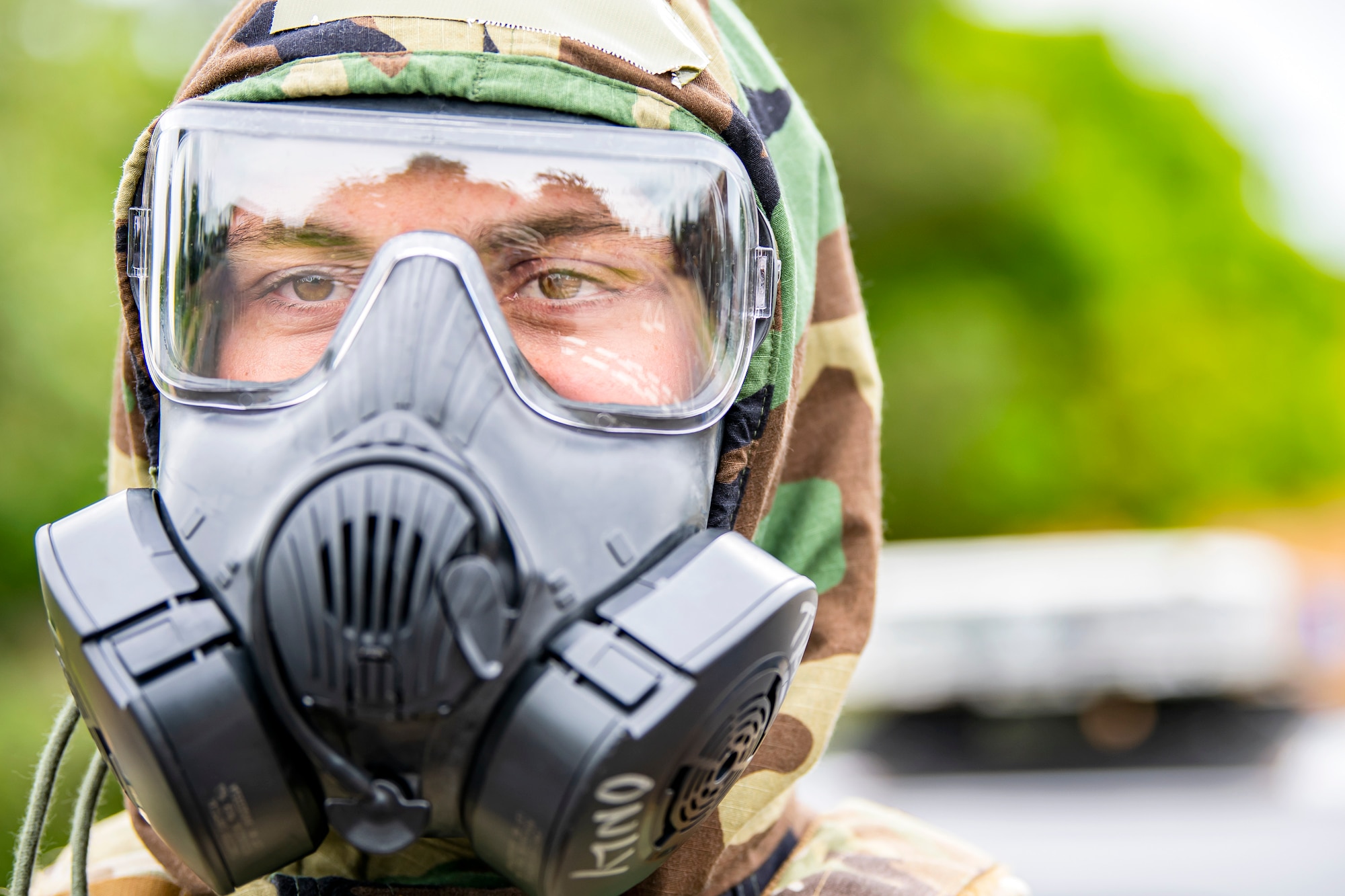 An Airman from the 423d Security Forces Squadron, participates in an exercise at RAF Alconbury, England, May 19, 2022. The exercise was geared towards training Airmen on how to properly control and examine a contaminated area after a simulated chemical attack while in Mission Oriented Protective Posture Gear. (U.S. Air Force photo by Staff Sgt. Eugene Oliver)