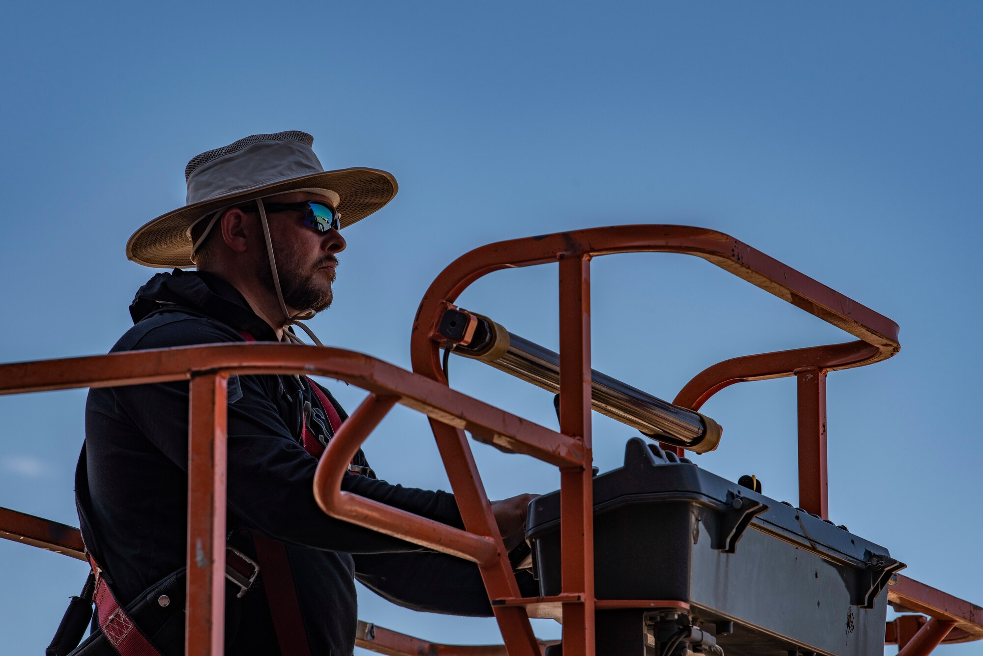 Clay Bossung, installation technician for By Light, operates a boom lift at Dyess Air Force Base, Texas, May 11, 2022. Efficient flight line Wi-Fi streamlines communication between maintenance Airmen. (U.S. Air Force photo by Airman 1st Class Ryan Hayman)