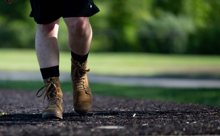 Airman rucks down path