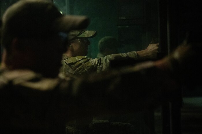 Airmen fire weapons