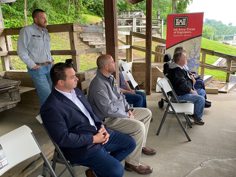Steven Hayes (standing), civil engineer technician at Lake Cumberland; and (sitting left to right) Somerset Mayor Alan Keck; Chris Girdler, president and CEO of Somerset-Pulaski Economic Development Authority (SPEDA); and Montie and Sandy Stigall attend the ribbon cutting ceremony May 23, 2022, at Waitboro Recreation Area in Somerset, Kentucky. (USACE Photo by HEATHER KING)
