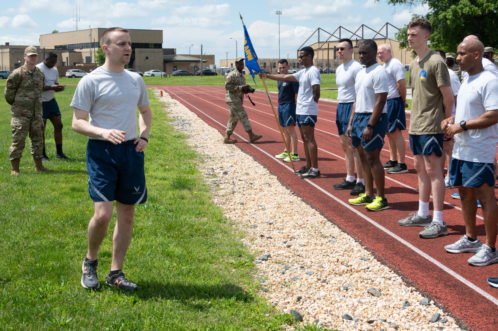 U.S. Air Force Captain Alex Lenser, 69th Aerial Port Squadron flight commander of ramp operations, gives closing remarks to 459th LRS Airmen following the completion of a memorial run at Joint Base Andrews, Maryland, May 15, 2022. The run, which began at Kadena Air Base, Japan, in 2013, honors Air Transportation Airmen who lost their lives over the past year. Seven aerial port Airmen died last year. Members in the career field say "they are 'blocked out,' but not forgotten." (U.S. Air Force Photo by Staff Sgt. Andreaa Phillips)