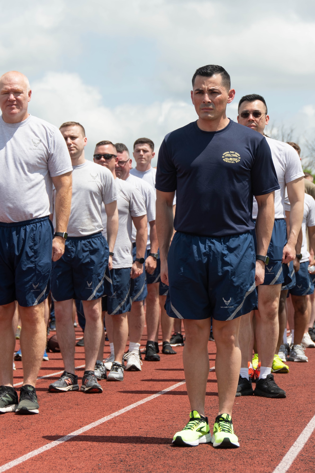 Airmen from the 69th Aerial Port Squadron stand in formation prior to participating in the Annual Port Dawg Memorial run at Joint Base Andrews, Md., May 15, 2022. The run, which began at Kadena Air Base, Japan, in 2013, honors Air Transportation Airmen who lost their lives over the past year. Seven aerial port Airmen died last year. Members in the career field say "they are 'blocked out,' but not forgotten." (U.S. Air Force Photo by Staff
Sgt. Andreaa Phillips)
