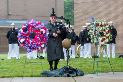 Bagpiper Tom Metz, a retired Lt. Col. from the United States Army, performed "Amazing Grace" during Norfolk Naval Shipyard's annual Memorial Day Fall-In for Colors May 25.