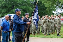 Norfolk Naval Shipyard Veterans Employee Readiness Group Founding Member Jonathan Echols joins fellow shipyarders and Sailors during the annual Memorial Day Fall-In for Colors May 25.