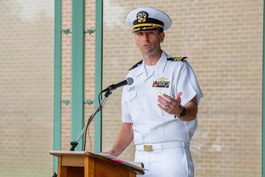 The guest speaker for Norfolk Naval Shipyard's annual Memorial Day Fall-In for Colors May 25 was Commander Frank Gasperetti, Code 900 Production Resource Officer for the shipyard. He shared a story of his fallen friend, Lt. Col. Geoff Hollopeter of the U.S. Marine Corps. “Geoff’s death left an unfillable hole in the hearts of his family, his community and all those he touched. His friendships, his bravery and his commitment to duty will never be lost," he said. "I must continue to share stories of Geoff as we as a Nation must continue to share the stories of our fallen to remember what they sacrificed for the rest of us. Not many people decide for themselves to put their lives on the line to protect our freedom, defend our Constitution, and to volunteer to serve, knowing that death may be the outcome and for over a million military members, they made that ultimate sacrifice since the Revolutionary War. What we can do today, every day, is to ensure that those who make this choice and make the ultimate sacrifice can rest knowing they served with the thanks of grateful citizens and knowing that they will not be forgotten.”