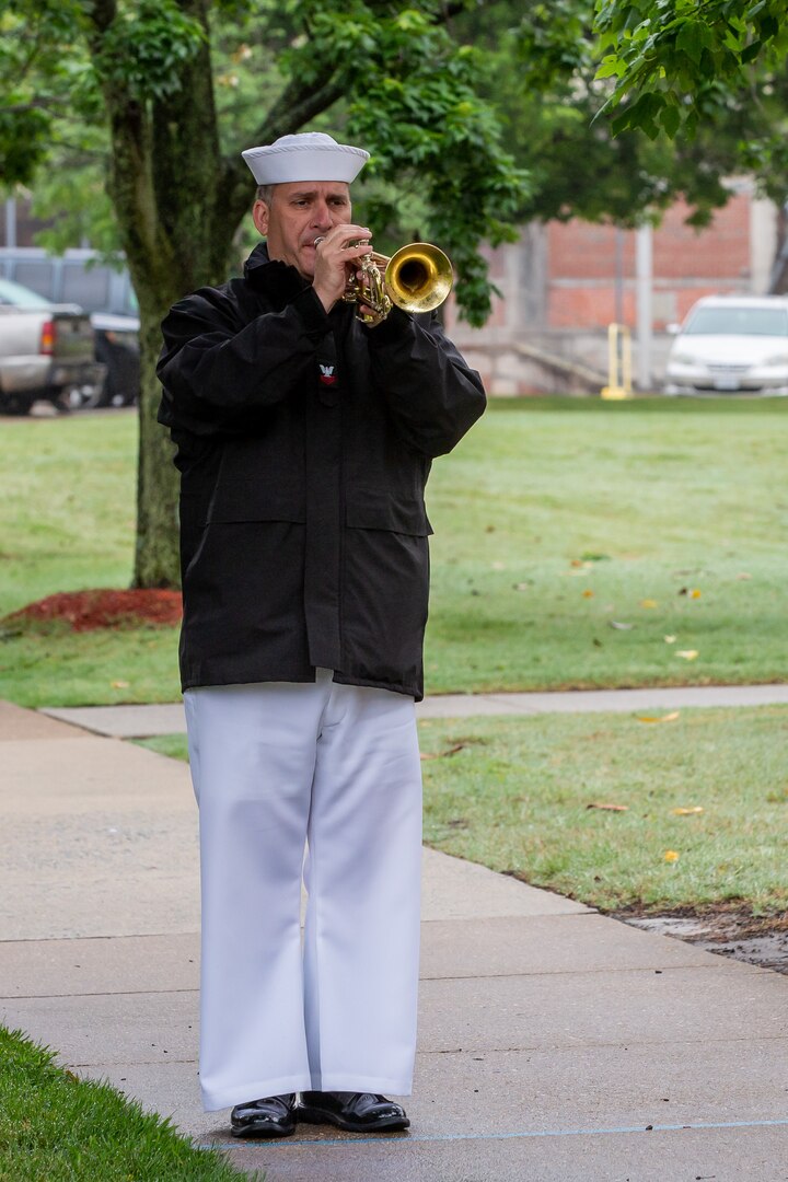 A bugler with the U.S. Fleet Forces Band performed "Taps" during the Norfolk Naval Shipyard's annual Memorial Day Fall-In for Colors May 25.
