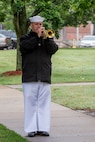 A bugler with the U.S. Fleet Forces Band performed "Taps" during the Norfolk Naval Shipyard's annual Memorial Day Fall-In for Colors May 25.