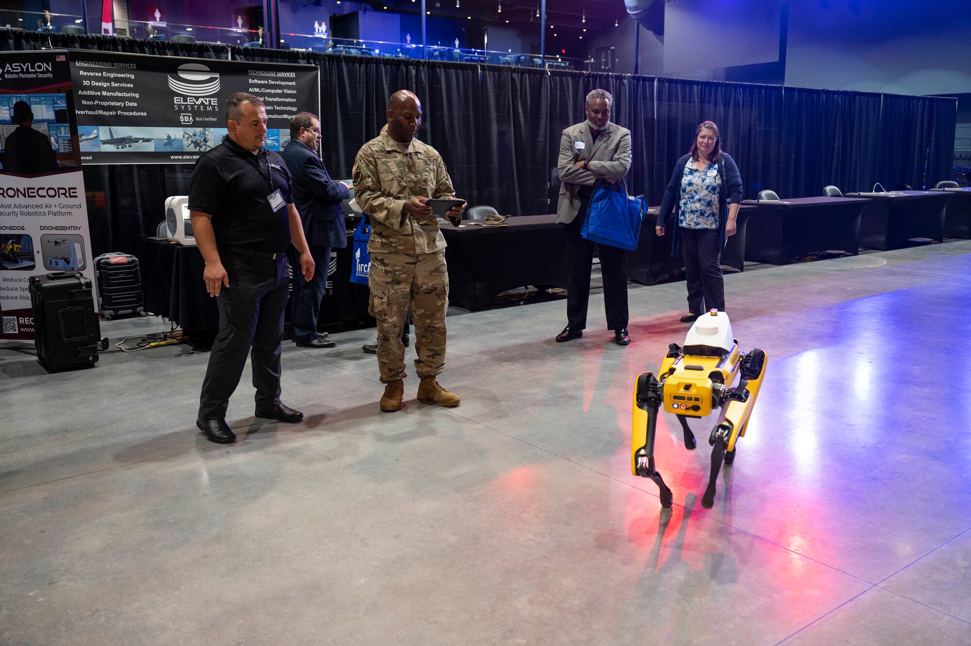 A panel of judges ask questions to submitters as they pitch their innovation ideas live during the iChallenge competition portion of Innovation Day at FORCECON 2022