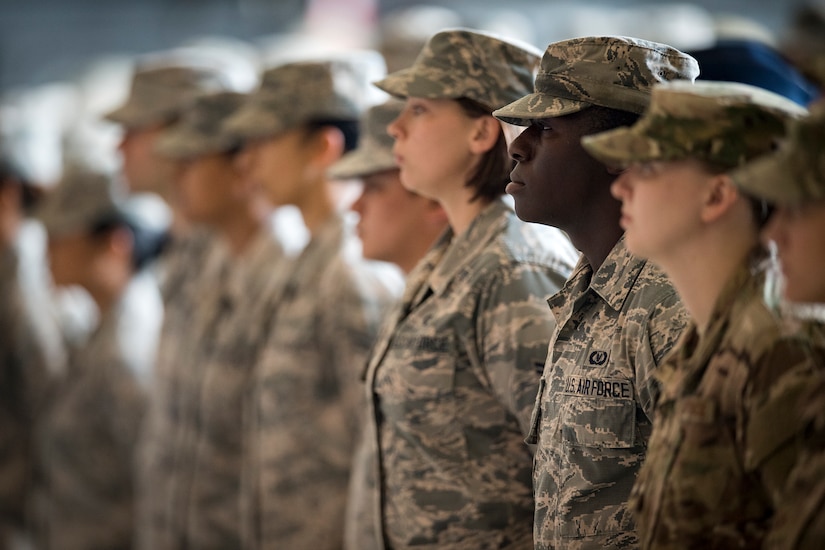 Military members stand in formation.