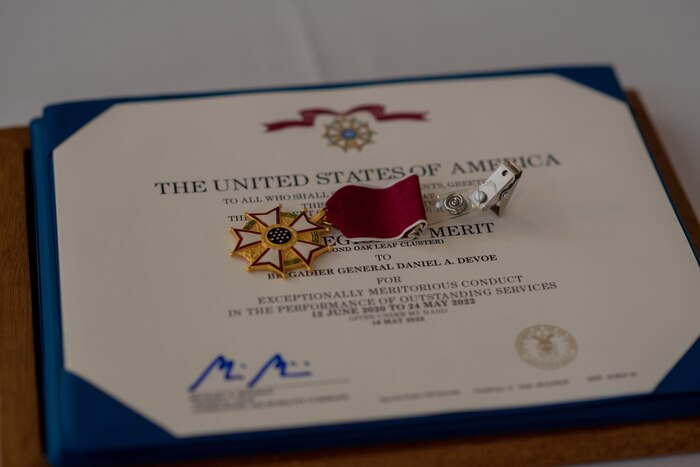 The Legion of Merit medal sitting on a table.