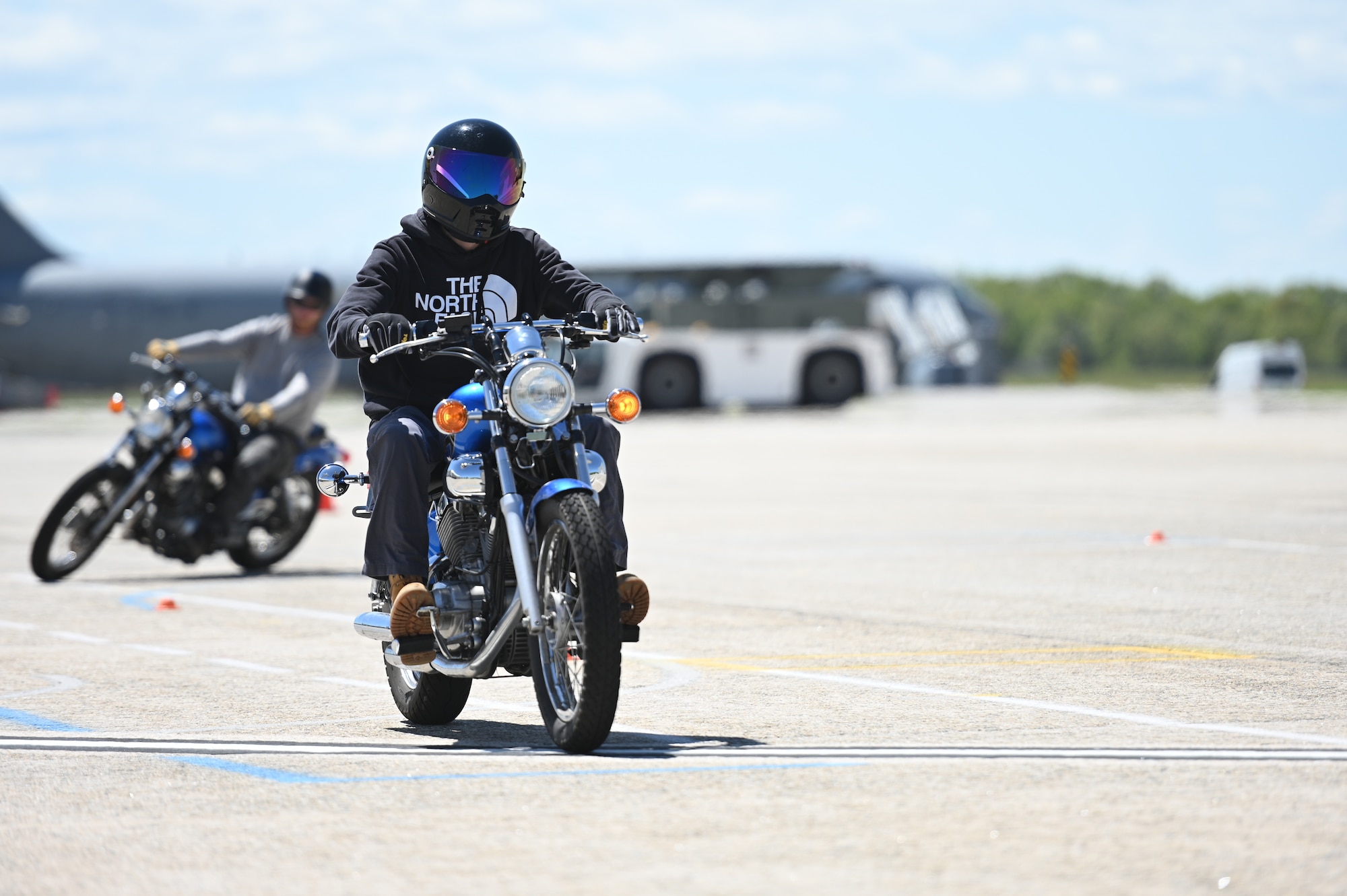 Motorcyclist rides on base.