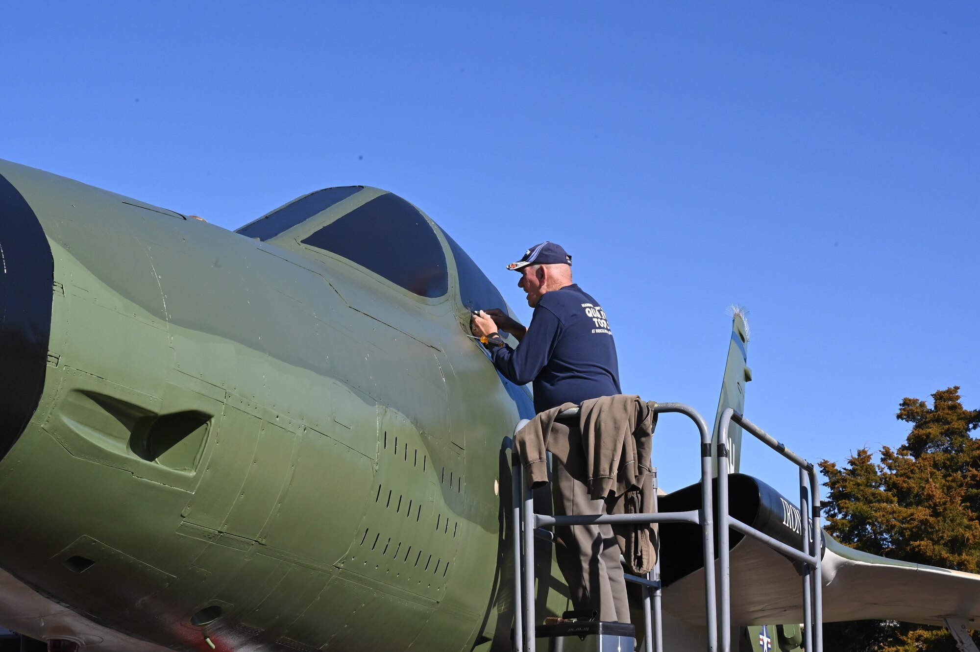 Maintenance crews work on jet