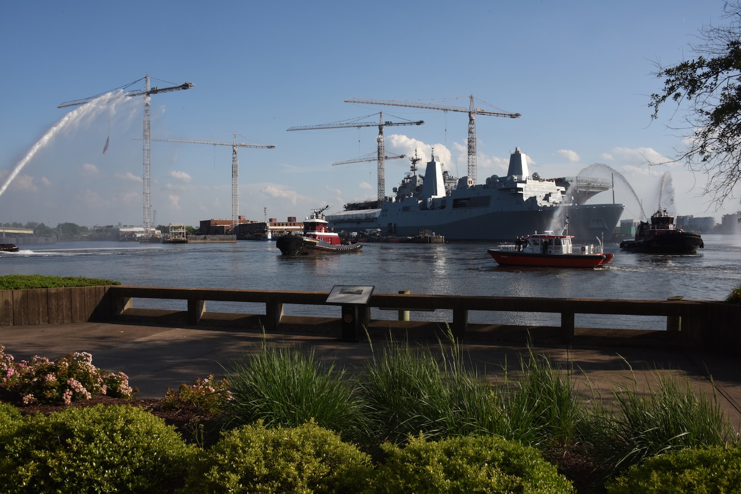 Tugboats jettison water into the air during a ‘water salute’ held in honor of National Maritime Day in downtown Norfolk, Virginia, May 19.