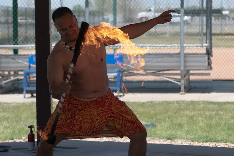 Ikaika Hafoka, a member of Kalama Polynesian Dancers, performs a fire show at Buckley Space Force Base, Colo., May 13, 2022.